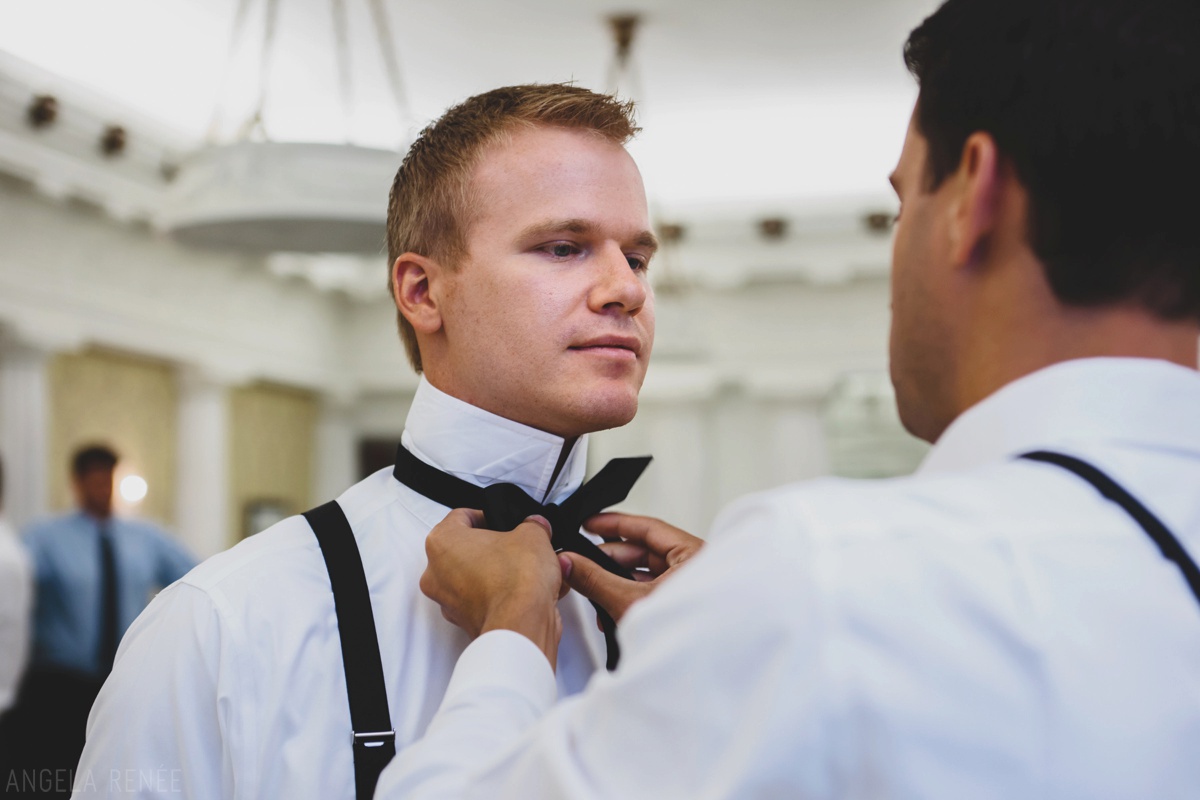 groom-putting-tie-on