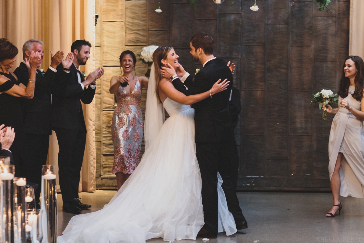 bride and groom after first kiss