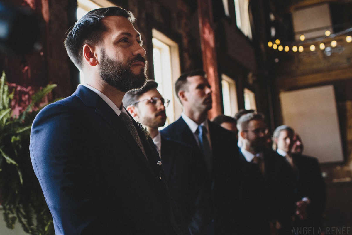 groom looking at bride