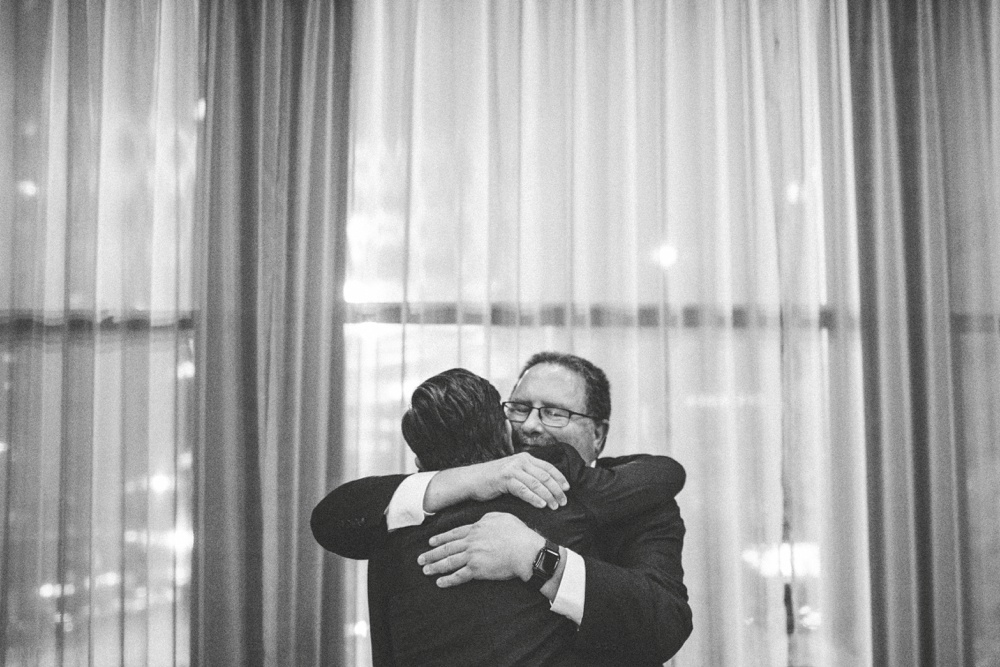 dad-hugging-groom