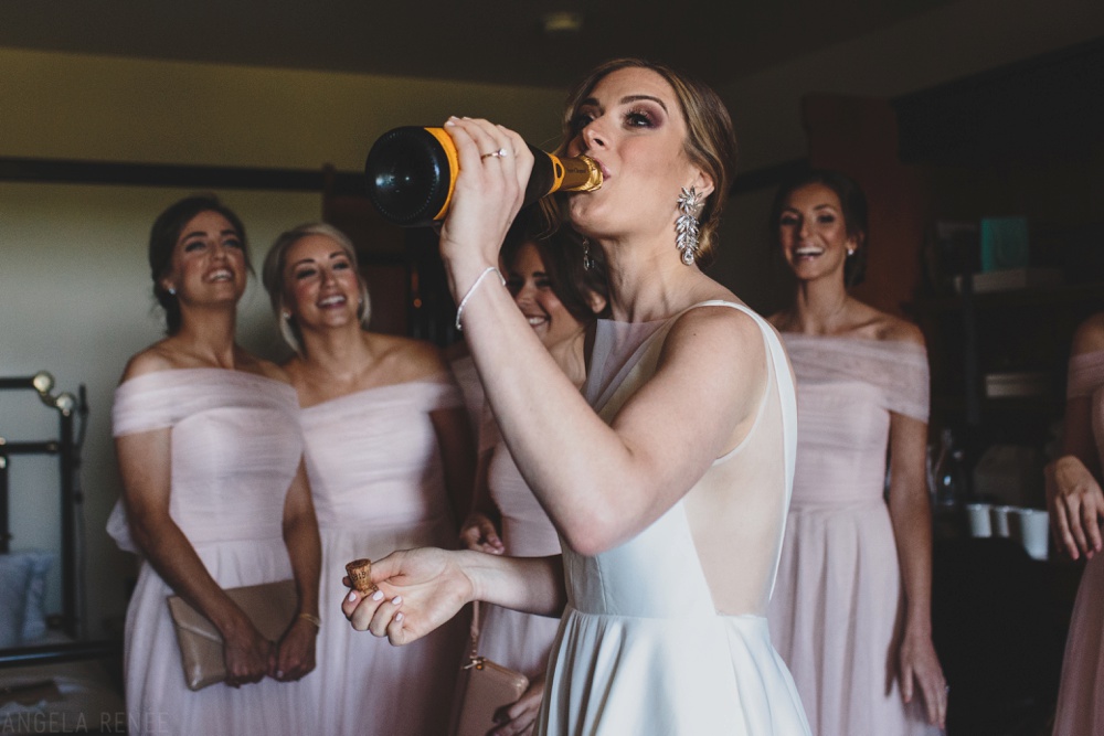 bride-putting-on-dress